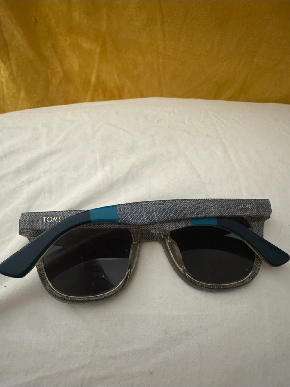 Tom’s sunglasses one for one